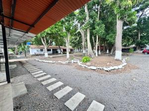 een groep stenen trappen in een park met bomen bij Lofts #9 & #6 Surf EcoVilla Playa El Sunzal in El Sunzal