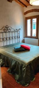 Postel nebo postele na pokoji v ubytování Casa del borgo