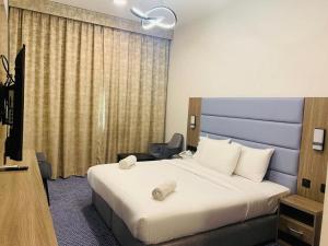 Postel nebo postele na pokoji v ubytování Silver Sand Hotel