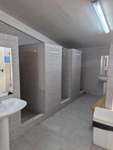 a bathroom with a shower and a sink at Glamping Montanejos in Montanejos