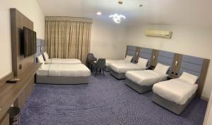 Postel nebo postele na pokoji v ubytování Silver Sand Hotel