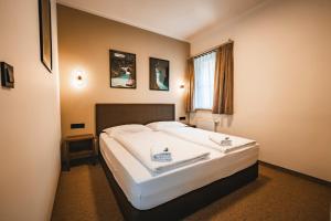 Postel nebo postele na pokoji v ubytování Guest House EJGA