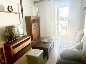 a living room with a tv and a couch at Mirador Paraiso in Adeje