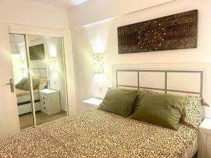 a bedroom with a bed and a large mirror at Mirador Paraiso in Adeje +8 photos