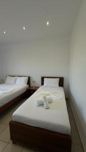 Postel nebo postele na pokoji v ubytování Enelia Apartments