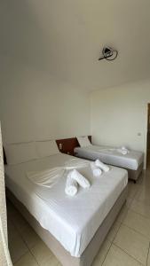 Postel nebo postele na pokoji v ubytování Enelia Apartments