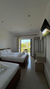 Postel nebo postele na pokoji v ubytování Enelia Apartments