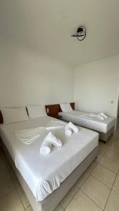 Postel nebo postele na pokoji v ubytování Enelia Apartments