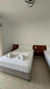 Postel nebo postele na pokoji v ubytování Enelia Apartments