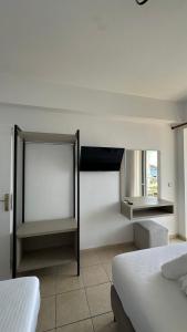 Postel nebo postele na pokoji v ubytování Enelia Apartments