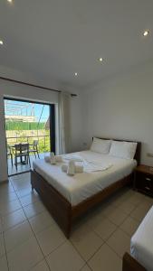 Postel nebo postele na pokoji v ubytování Enelia Apartments