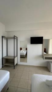 Postel nebo postele na pokoji v ubytování Enelia Apartments
