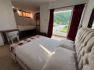Postel nebo postele na pokoji v ubytování Bahia B&B