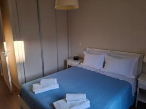 Cama ou camas em um quarto em Alojamento Calypso