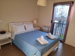 Cama ou camas em um quarto em Alojamento Calypso