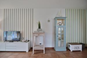 Μια τηλεόραση ή/και κέντρο ψυχαγωγίας στο Sunshine-Residenz Sunshine Residenz Appartement 1 Godewind