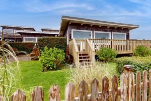 a wooden fence in front of a house at Periwinkle in Pacific Beach
