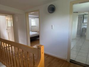 a room with a staircase and a room with a bed at am alten Backhaus 1 in Heuchelheim