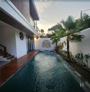 a swimming pool in the backyard of a house at Canggu Velvet Oasis - Private Villa 3Bedroom in Dalung