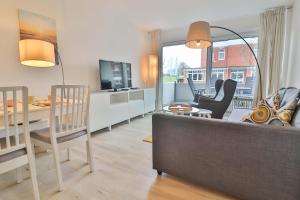 TV a/nebo společenská místnost v ubytování Sand & Seele