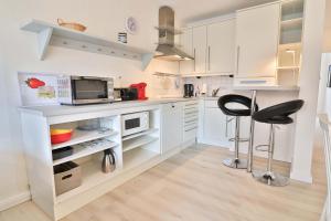 Kuchyň nebo kuchyňský kout v ubytování Sand & Seele + 7 fotografií