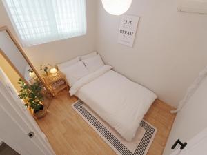 Postel nebo postele na pokoji v ubytování Hue house