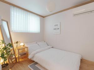 Postel nebo postele na pokoji v ubytování Hue house