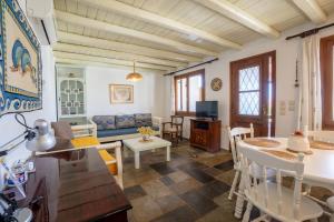 a living room with a couch and a table at Villa Ma-Re in Hersonissos