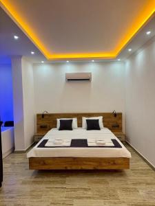 a bedroom with a large bed in a room at Kalkan da Vaıllant Villa in Kaş +17 photos