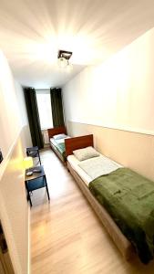 Postel nebo postele na pokoji v ubytování Green Hostel