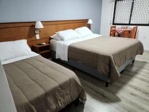 Postel nebo postele na pokoji v ubytování Trinidad Inn Trinidad