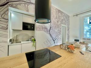 Η κουζίνα ή μικρή κουζίνα στο Happy Family Apartments Orefici +8 φωτογραφίες