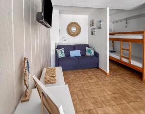 Ένα ή περισσότερα κρεβάτια σε δωμάτιο στο Logement très calme à Saint-Cyprien 300m de la plage
