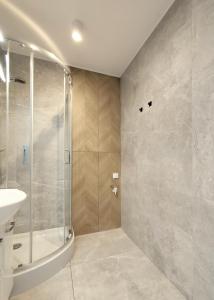 a bathroom with a shower and a sink at Fabryka Loft 3B # Nestapartamenty in Bielsko-Biała +12 photos