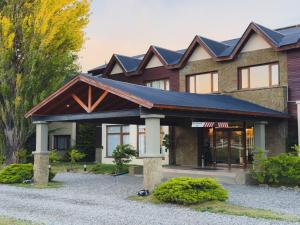 a house with solar panels on its roof at Rochester Calafate in El Calafate