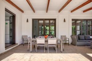 a dining room with a table and chairs at Villa Siegfried JÁVEA in Benitachell