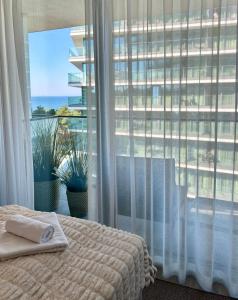 Postel nebo postele na pokoji v ubytování Wave - Beach Style Studio & Sea View + 45 fotografií