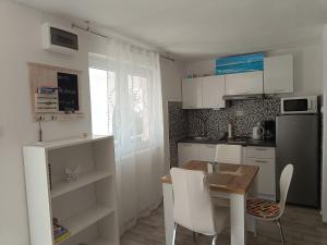 Kuchyň nebo kuchyňský kout v ubytování Apartment Inter Vivos + 37 fotografií