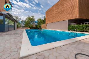 a swimming pool in front of a building at Вилла Biala family haven in Byala