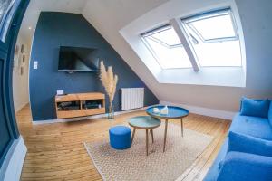 Μια τηλεόραση ή/και κέντρο ψυχαγωγίας στο Appartement très lumineux - vue sur la ville - 4 personnes