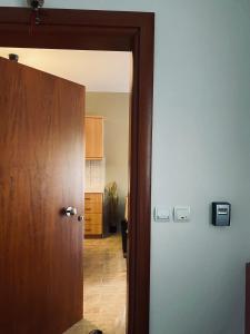 a door leading into a room with a hallway at Seaesta House in Keramotí +7 photos