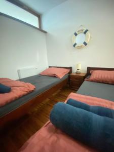 a bedroom with two twin beds and a window at Wave and Sun Apartment in Hel +33 photos