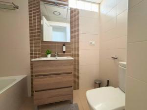 a bathroom with a sink and a toilet and a mirror at Horizon Santa Monica in Aguadulce +19 photos