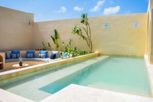a swimming pool in a villa with a patio at Studio in La Veleta with private rooftop in Tulum