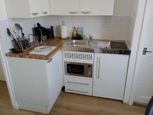 Kuchyň nebo kuchyňský kout v ubytování Cranbury House Apartments + 26 fotografií