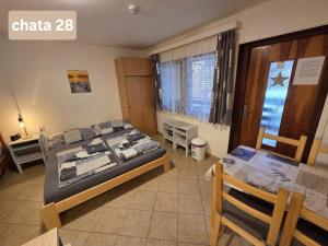 Llit o llits en una habitació de Chatky U Davida Máchovo jezero