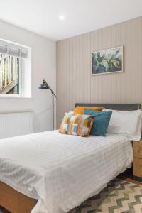 Voodi või voodid majutusasutuse Chicstay Suites toas