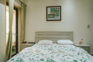 Postel nebo postele na pokoji v ubytování Sea La Vie Inn + 21 fotografií