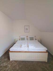 Voodi või voodid majutusasutuse Penzion Apartmány Libošovice toas