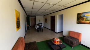 a living room with a couch and a table at Xios Apartment in Guayaquil